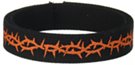 orange barbed wire pattern on roll of black webbing